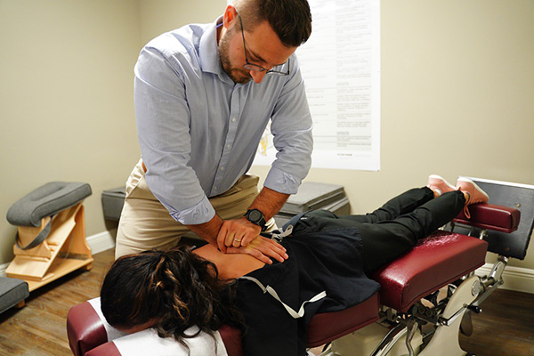 Chiropractor Oakland FL Robert White Back Adjustment on Patient Office Tour