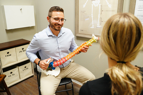 Chiropractor Oakland FL Robert White With Patient Office Tour